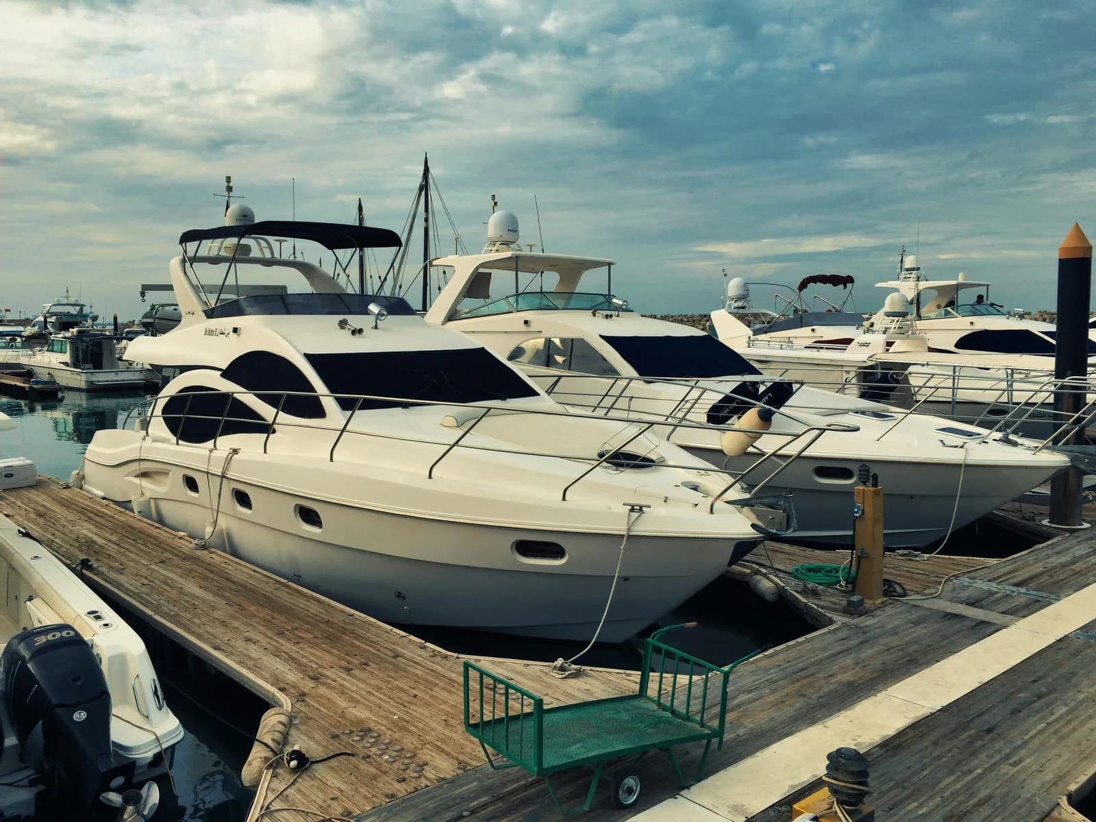 White yacht docked at a Southern California marina with clean polished hull