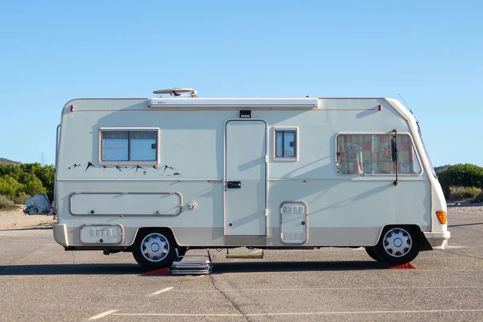 Class A motorhome RV parked at a Southern California campsite with clean exterior